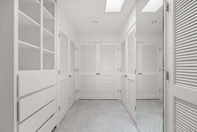 384 Chaparral Ln, Corrales, NM 87048 - hall with light floors and recessed lighting