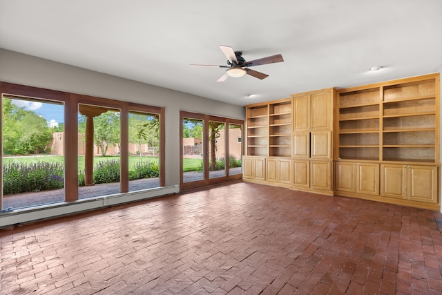 384 Chaparral Ln, Corrales, NM 87048 - unfurnished living room with a ceiling fan, brick floors, and baseboard heating