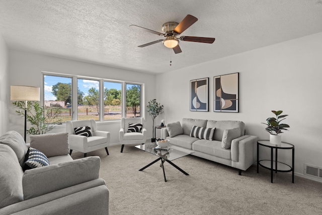11 Riverside Rd, Peralta, NM 87042 - carpeted living area featuring a textured ceiling, ceiling fan, and baseboards