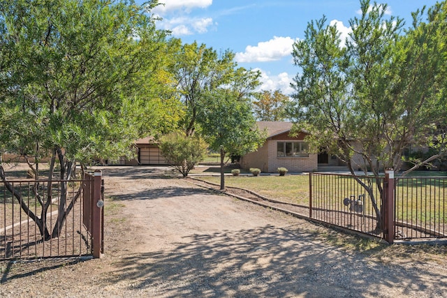 11 Riverside Rd, Peralta, NM 87042 - view of property hidden behind natural elements featuring a gate and brick siding
