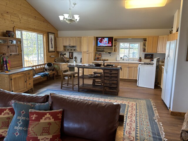 37 Lasso Ln, Pie Town, NM 87827 - kitchen featuring white appliances, open shelves, light brown cabinets, vaulted ceiling, and a chandelier