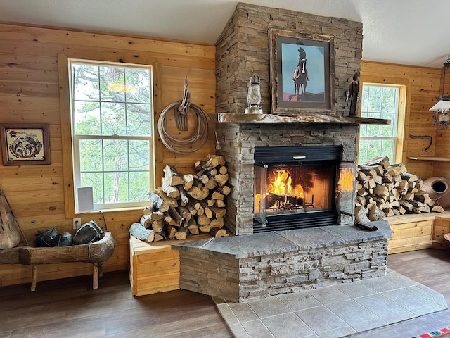 37 Lasso Ln, Pie Town, NM 87827 - living area with wood finished floors, wood walls, and a fireplace