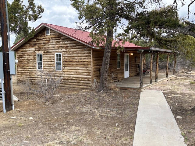 37 Lasso Ln, Pie Town, NM 87827 - view of home's exterior featuring a metal roof and a porch