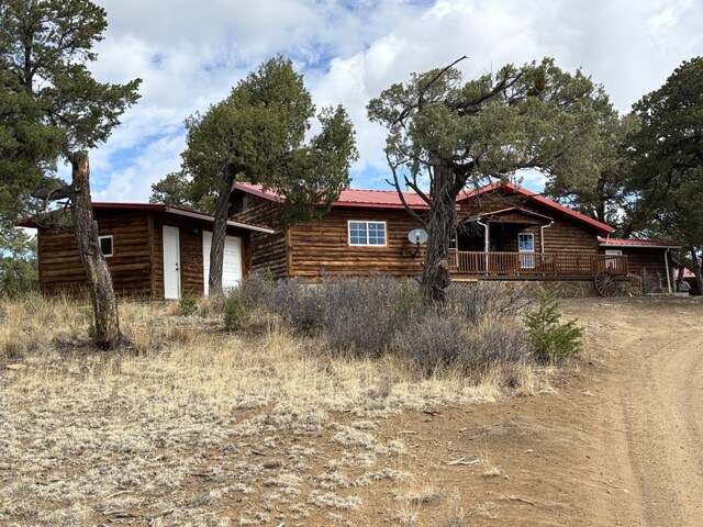 37 Lasso Ln, Pie Town, NM 87827 - view of front facade with a garage