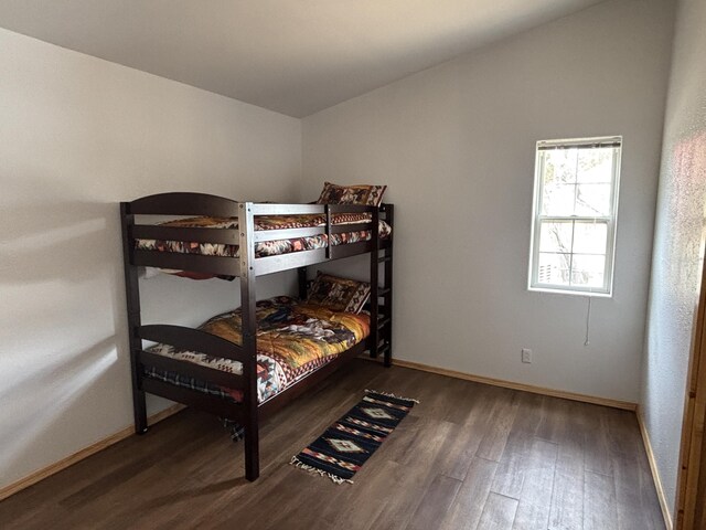 37 Lasso Ln, Pie Town, NM 87827 - bedroom with wood finished floors and baseboards