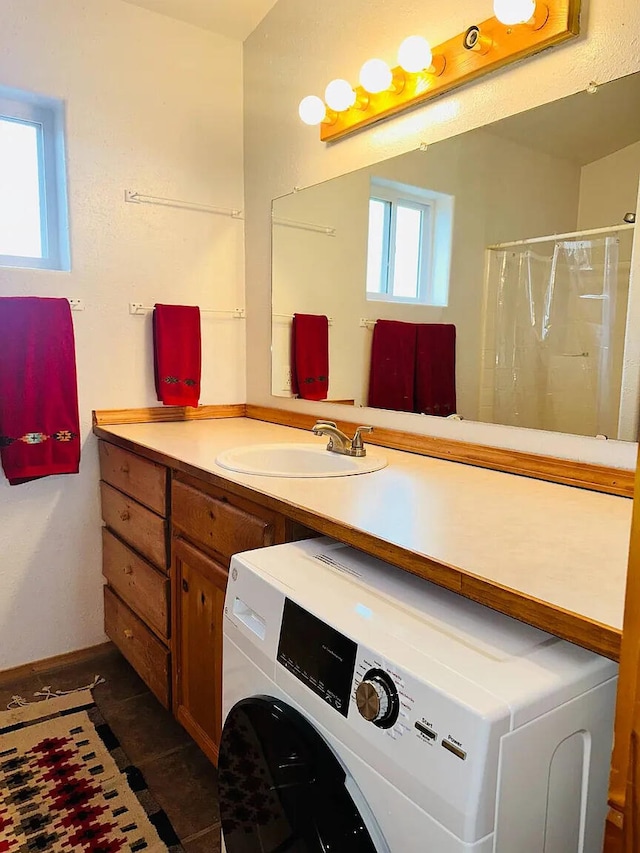 37 Lasso Ln, Pie Town, NM 87827 - laundry room featuring washer / clothes dryer and dark tile patterned flooring