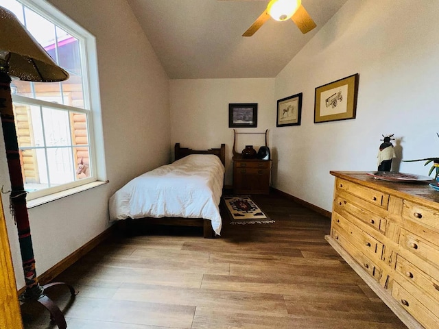 37 Lasso Ln, Pie Town, NM 87827 - bedroom with vaulted ceiling, wood finished floors, and ceiling fan