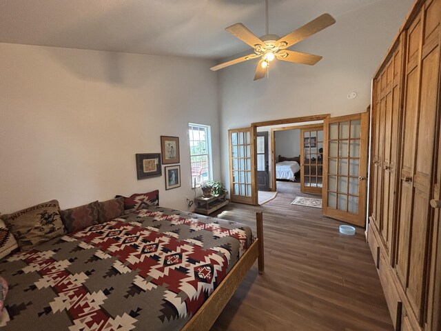 37 Lasso Ln, Pie Town, NM 87827 - bedroom with french doors, dark wood finished floors, high vaulted ceiling, and ceiling fan