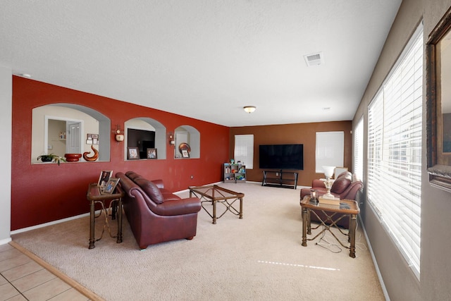 1181 Colibri Ave NW, Los Lunas, NM 87031 - living area with carpet flooring, healthy amount of natural light, and baseboards