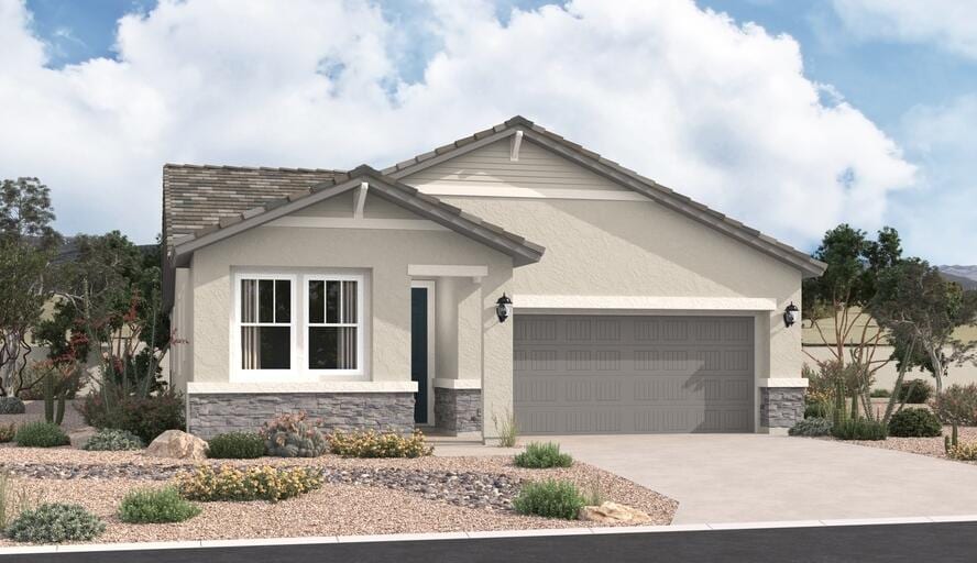 3117 Wolf Tail Loop NE, Rio Rancho, NM 87144 - view of front of home with stone siding, stucco siding, a garage, and driveway