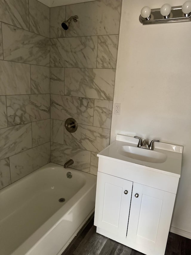 410 Utah St NE, Albuquerque, NM 87108 - full bath featuring vanity, bathtub / shower combination, and wood finished floors