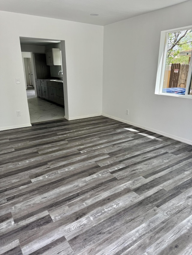 410 Utah St NE, Albuquerque, NM 87108 - empty room with a sink, wood finished floors, and baseboards