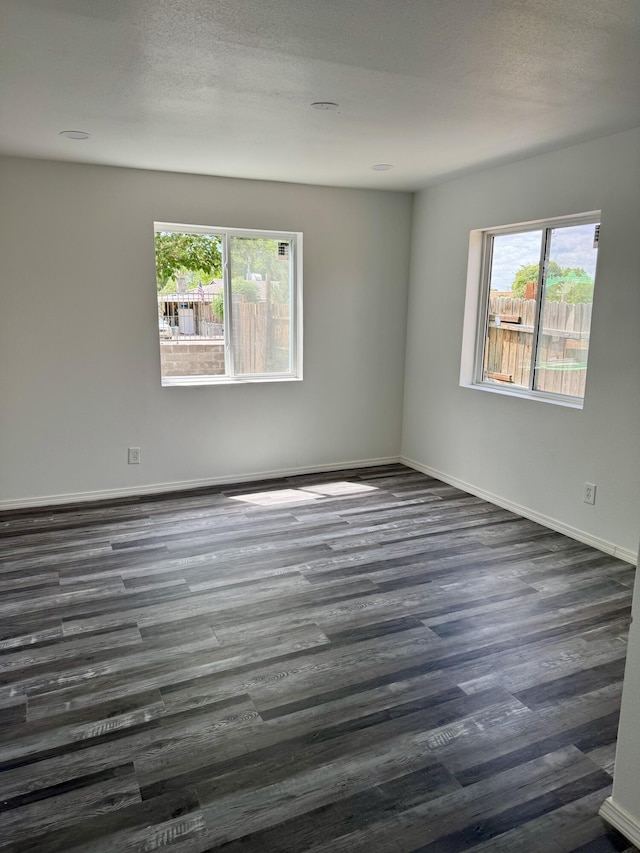 410 Utah St NE, Albuquerque, NM 87108 - empty room with dark wood-style floors and baseboards