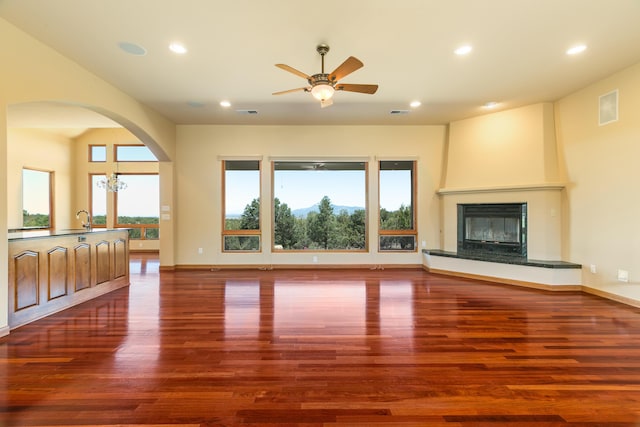 9 Canon Escondido, Sandia Park, NM 87047 - unfurnished living room with dark wood-type flooring, plenty of natural light, a ceiling fan, and recessed lighting