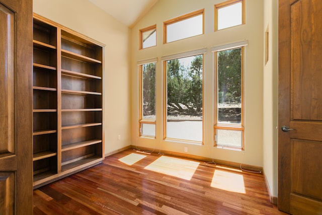 9 Canon Escondido, Sandia Park, NM 87047 - doorway to outside with dark wood-style floors, baseboards, and vaulted ceiling