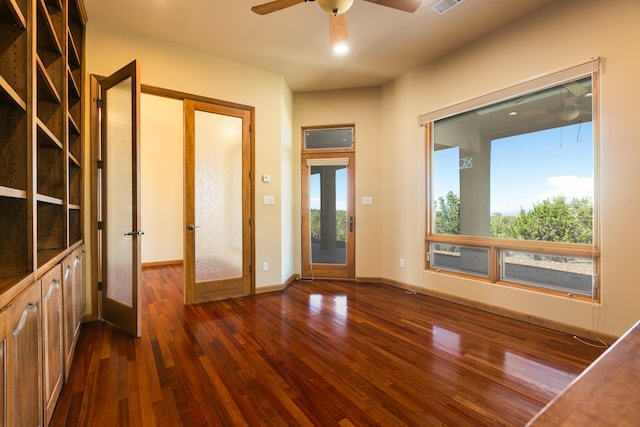9 Canon Escondido, Sandia Park, NM 87047 - spare room featuring french doors, dark wood-type flooring, a ceiling fan, and baseboards