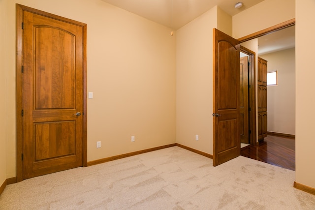 9 Canon Escondido, Sandia Park, NM 87047 - unfurnished bedroom with carpet flooring, baseboards, and a closet