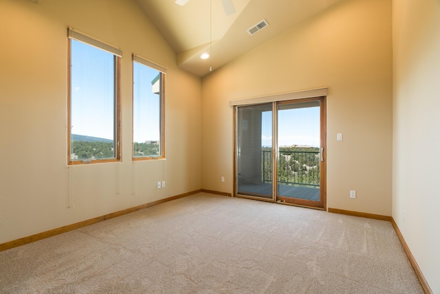 9 Canon Escondido, Sandia Park, NM 87047 - carpeted empty room with plenty of natural light, a ceiling fan, high vaulted ceiling, and baseboards