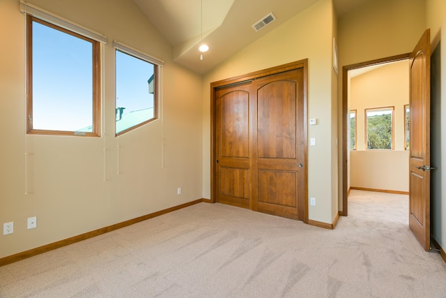 9 Canon Escondido, Sandia Park, NM 87047 - unfurnished bedroom with lofted ceiling, light colored carpet, and baseboards
