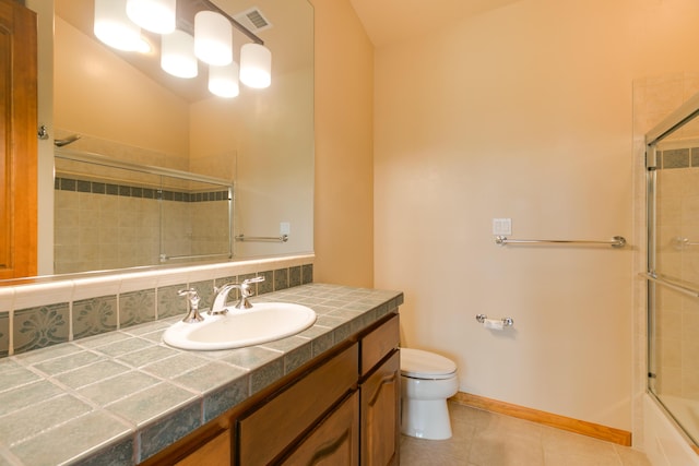 9 Canon Escondido, Sandia Park, NM 87047 - full bathroom with toilet, tile patterned floors, vanity, and backsplash