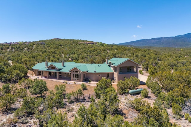 9 Canon Escondido, Sandia Park, NM 87047 - rear view of property with a forest view, covered porch, and metal roof