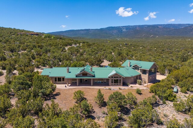 9 Canon Escondido, Sandia Park, NM 87047 - view from above of property with a mountain backdrop and a forest