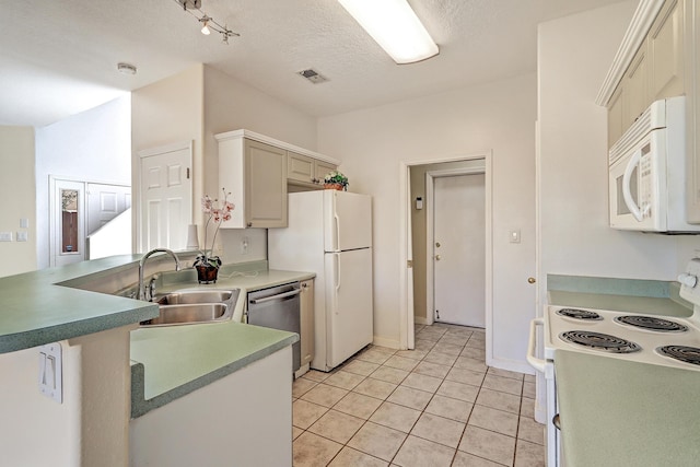 5209 Sugarbear Ct, Albuquerque, NM 87120 - kitchen with white appliances, a sink, light tile patterned floors, a textured ceiling, and baseboards
