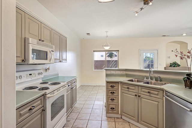 5209 Sugarbear Ct, Albuquerque, NM 87120 - kitchen with white appliances, a sink, light countertops, pendant lighting, and light tile patterned floors