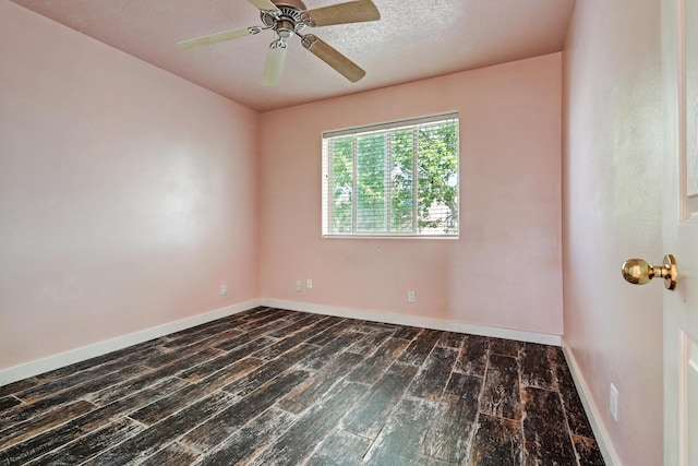 5209 Sugarbear Ct, Albuquerque, NM 87120 - empty room featuring dark wood finished floors, baseboards, ceiling fan, and a textured ceiling