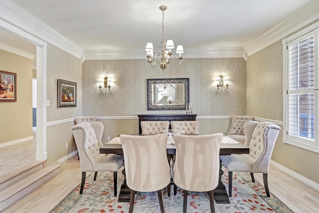 1513 Tinnin Rd NW, Los Ranchos, NM 87107 - dining space with wood finished floors, a chandelier, crown molding, and baseboards