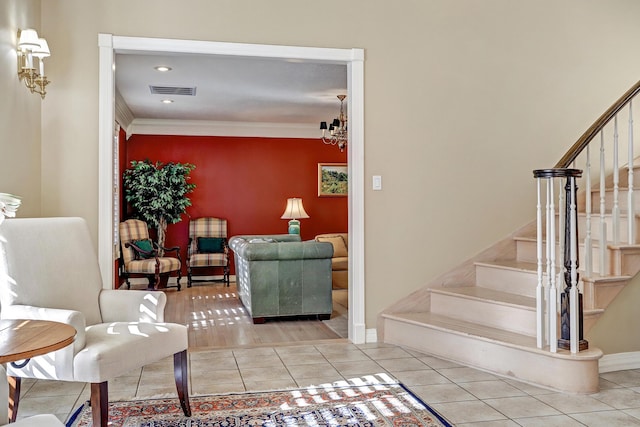 1513 Tinnin Rd NW, Los Ranchos, NM 87107 - stairs with tile patterned floors, a chandelier, ornamental molding, and recessed lighting