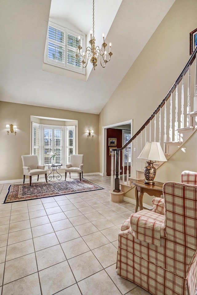1513 Tinnin Rd NW, Los Ranchos, NM 87107 - entryway with high vaulted ceiling, tile patterned flooring, a chandelier, baseboards, and stairs