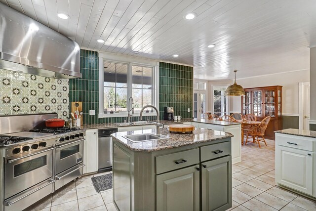 1513 Tinnin Rd NW, Los Ranchos, NM 87107 - entrance foyer featuring high vaulted ceiling, tile patterned flooring, a chandelier, and stairway