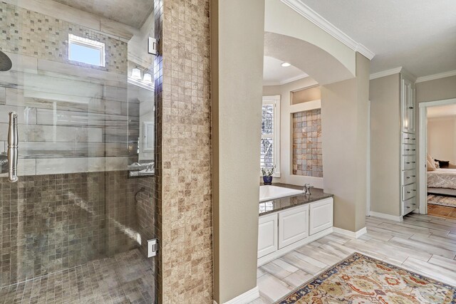 1513 Tinnin Rd NW, Los Ranchos, NM 87107 - ensuite bathroom with ornamental molding, a shower stall, and a bath