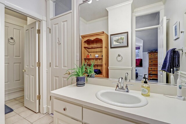 1513 Tinnin Rd NW, Los Ranchos, NM 87107 - bathroom with tile patterned flooring, vanity, and ornamental molding