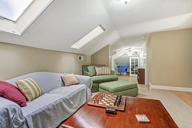 1513 Tinnin Rd NW, Los Ranchos, NM 87107 - carpeted living area with a skylight, lofted ceiling, and ceiling fan