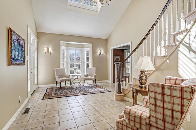 1513 Tinnin Rd NW, Los Ranchos, NM 87107 - foyer entrance featuring stairway, light tile patterned flooring, and high vaulted ceiling