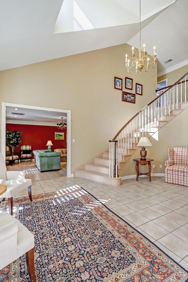 1513 Tinnin Rd NW, Los Ranchos, NM 87107 - living area featuring high vaulted ceiling, stairway, a chandelier, tile patterned flooring, and baseboards