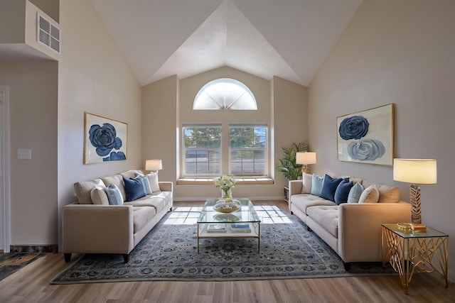 2308 Animas Ct NE, Rio Rancho, NM 87144 - living room with vaulted ceiling, wood finished floors, and baseboards