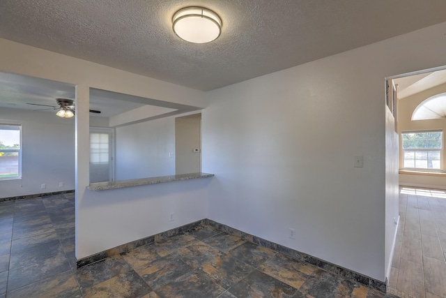 2308 Animas Ct NE, Rio Rancho, NM 87144 - unfurnished room featuring baseboards, ceiling fan, and a textured ceiling