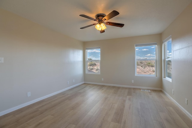 2308 Animas Ct NE, Rio Rancho, NM 87144 - unfurnished room featuring light wood-type flooring, a ceiling fan, and baseboards