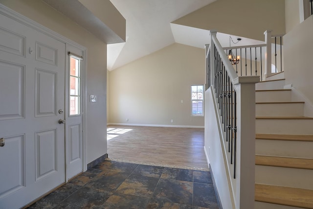 2308 Animas Ct NE, Rio Rancho, NM 87144 - entrance foyer featuring a chandelier, stairs, lofted ceiling, baseboards, and stone finish flooring