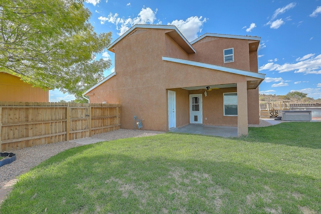 2308 Animas Ct NE, Rio Rancho, NM 87144 - back of property featuring stucco siding, ceiling fan, and a patio