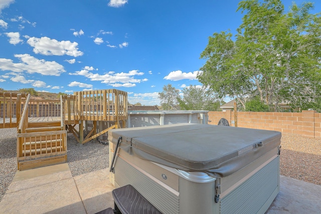 2308 Animas Ct NE, Rio Rancho, NM 87144 - view of patio featuring a hot tub, a deck, and fence