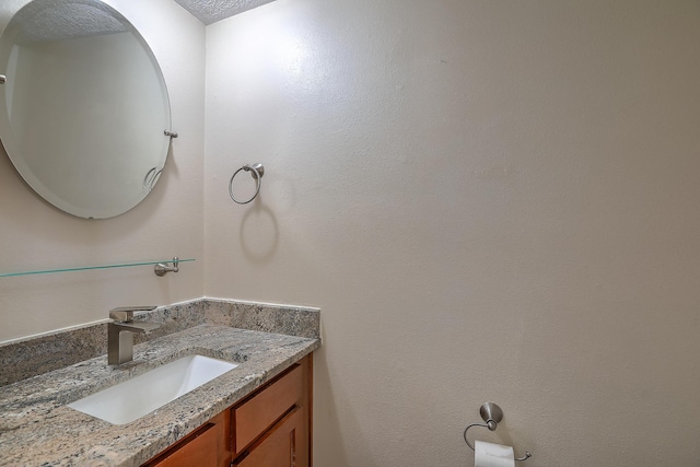 2308 Animas Ct NE, Rio Rancho, NM 87144 - bathroom featuring vanity and a textured ceiling