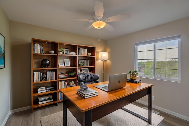 2308 Animas Ct NE, Rio Rancho, NM 87144 - home office with baseboards, a ceiling fan, and wood finished floors