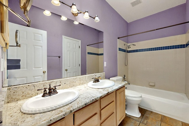 8720 Oakcrest Pl NW, Albuquerque, NM 87114 - bathroom with shower / tub combination, toilet, and double vanity