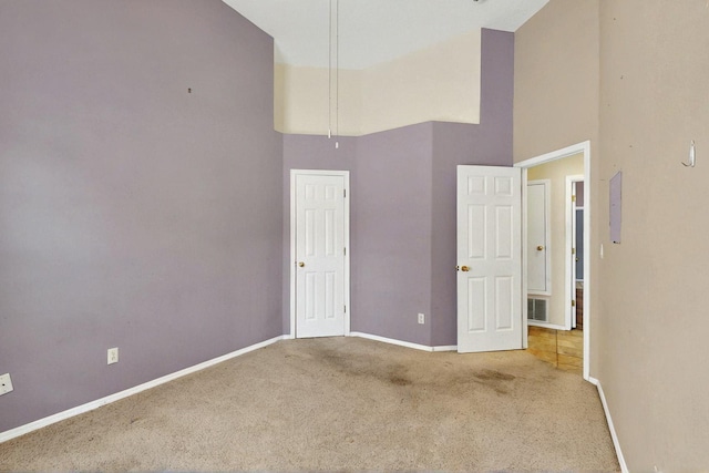 8720 Oakcrest Pl NW, Albuquerque, NM 87114 - carpeted spare room with a high ceiling and baseboards