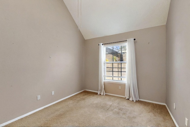 8720 Oakcrest Pl NW, Albuquerque, NM 87114 - spare room with lofted ceiling, light colored carpet, and baseboards