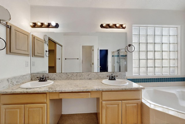 8720 Oakcrest Pl NW, Albuquerque, NM 87114 - bathroom with a bath, healthy amount of natural light, a shower stall, and double vanity